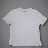 White t-shirt on a tiled floor